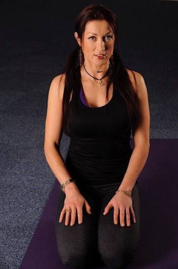 Yoga teacher leading an inclusive group class in Hampshire